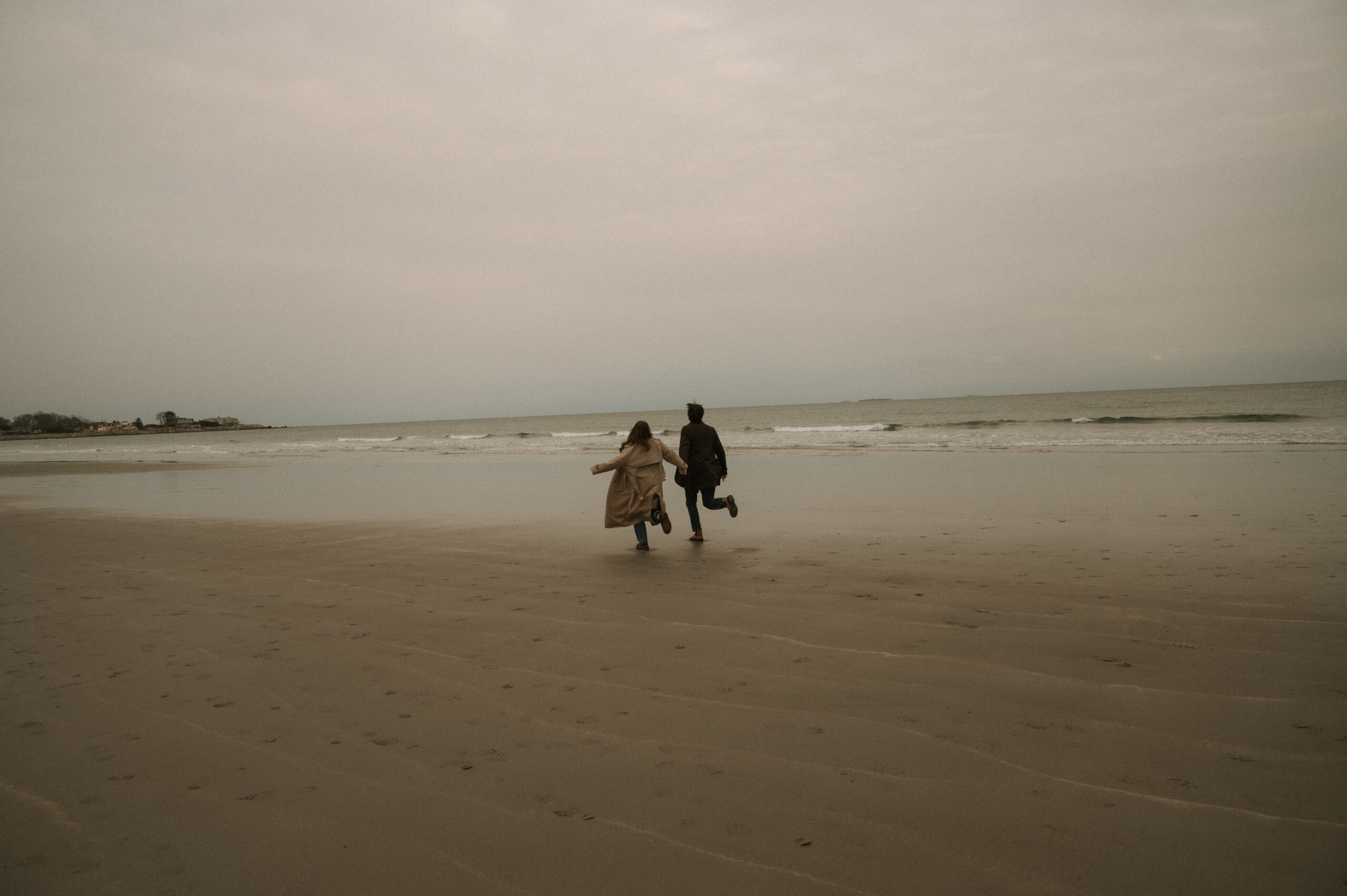 Coastal New England engagement session with muted tones and film-inspired editing